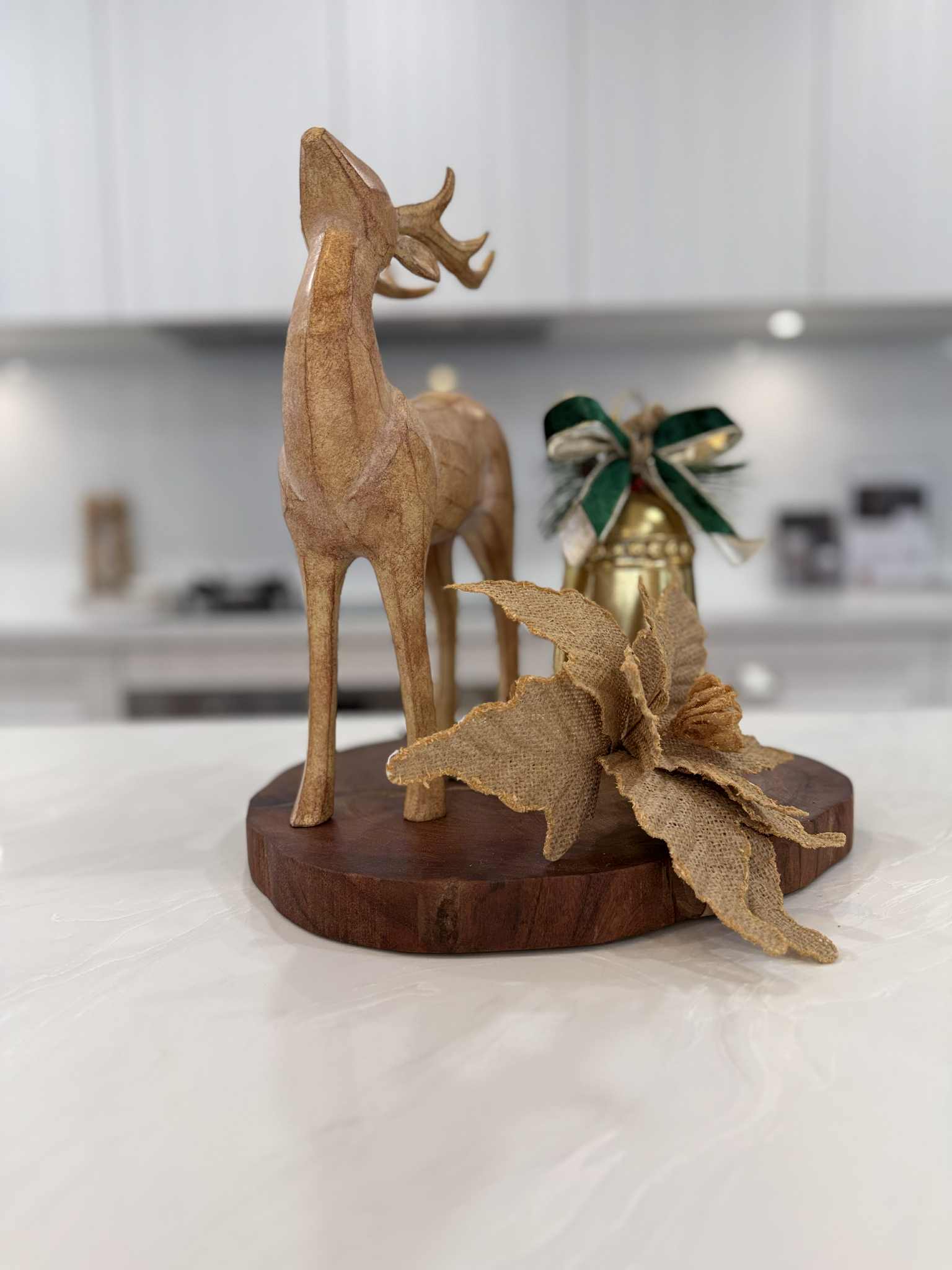 Harrington Kitchens Christmas Island Decor for the Kitchen featuring wooden deer and festive ornaments  
