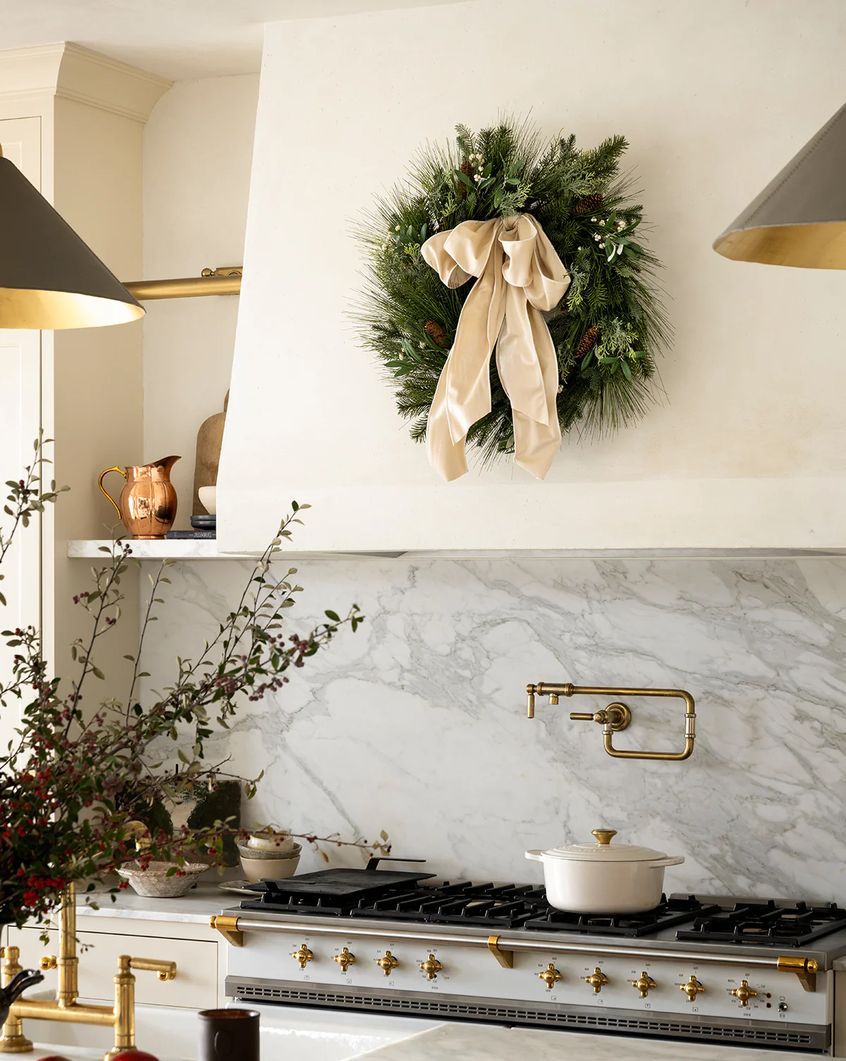 Studio Mcgree Wreath over a custom kitchen rangehood