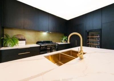 Bold concept with high class finish kitchen gold sink and tap on a big kitchen island in Bowral