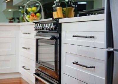 Classic black and white Hamptons kitchen with cooktop cabinetry Narellan Vale