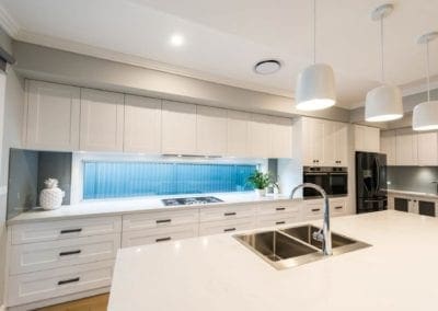 Contemporary Hamptons twist kitchen island with sink and tap Harrington Grove