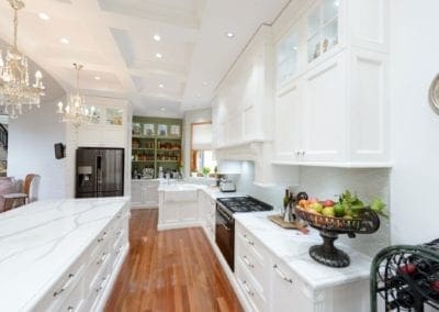 Old world bygone elegance kitchen Concord kitchen white cabinetry and green shelving