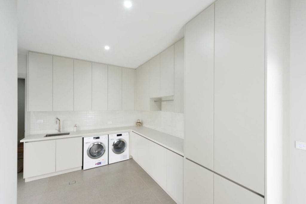 sleek streamlined stunning two toned kitchen Kirkham large bright laundry