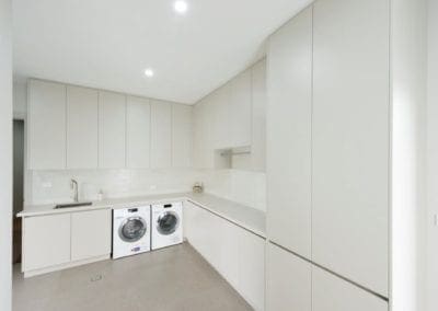 sleek streamlined stunning two toned kitchen Kirkham large bright laundry
