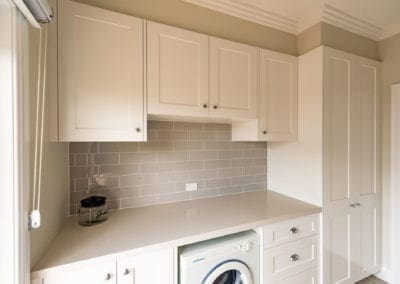 sophisticated classic hamptons style kitchen Harrington Grove white modern laundry