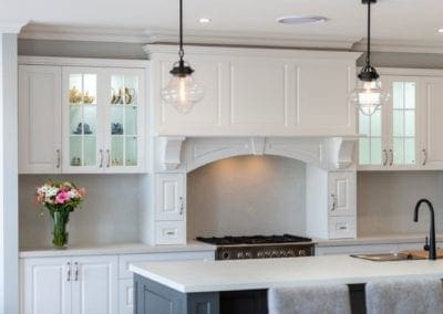 Striking two toned Hamptons kitchen Werombi surved mantle