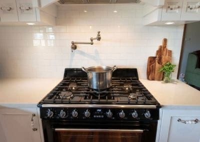 Traditional french provincial kitchen Razorback kitchen pot filler on stove