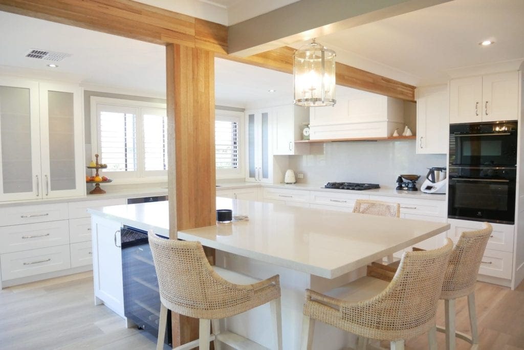 Contemporary Hamptons with timber highlights Barden Ridge with wooden bean, white cabinetry and stone benchtop wide shot