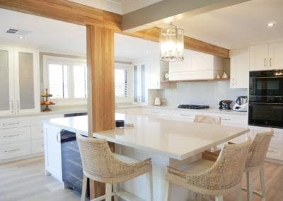 Contemporary Hamptons with timber highlights Barden Ridge with wooden bean, white cabinetry and stone benchtop wide shot