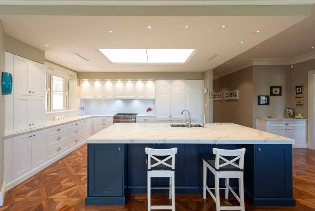 Divine two toned Hamptons kitchen wide view with blue cabinetry Mittagong