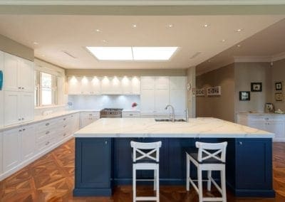 Divine two toned Hamptons kitchen wide view with blue cabinetry Mittagong
