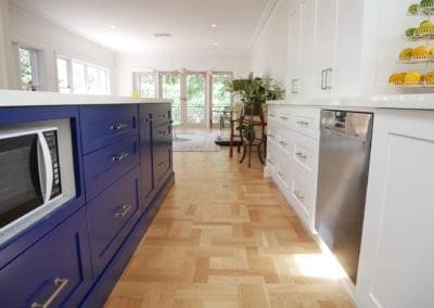 Dramatic two toned kitchen Blakehurst kitchen island microwave