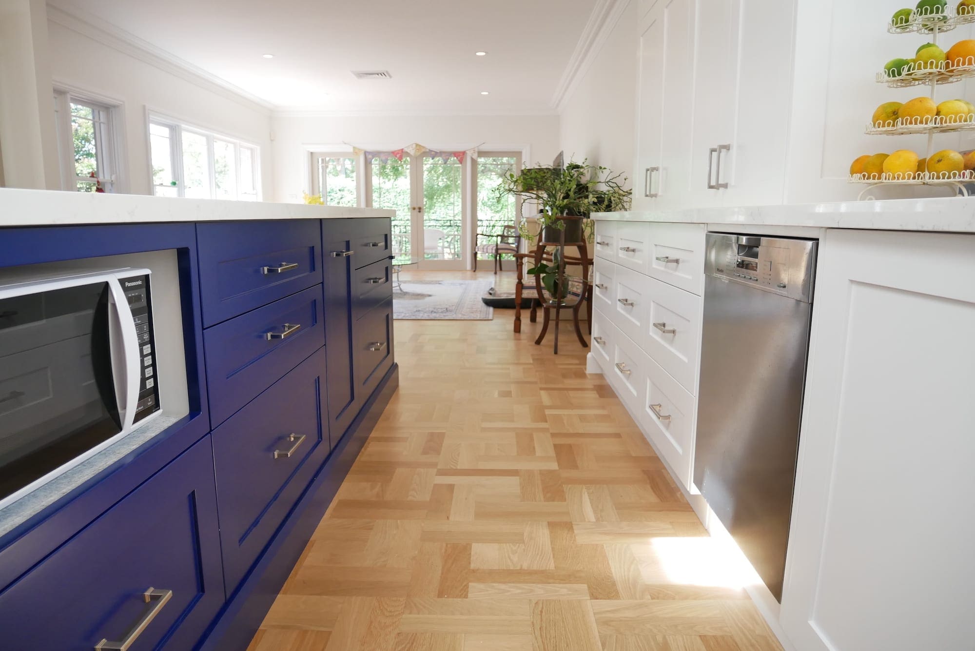 Dramatic-two-tone-kitchen-Blakehurst-island-microwave