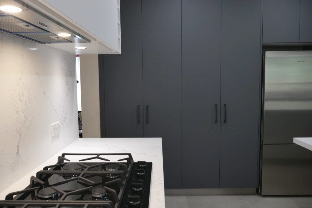 sleek black and white matte kitchen Harrington Park Laminex Stormcloud cabinetry