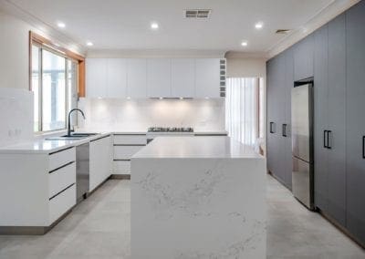 sleek black and white matte kitchen Harrington Park kitchen island wide shot