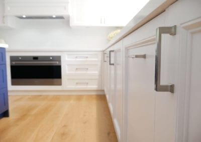 tranquil two toned family kitchen bowral silver handles close up