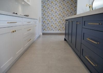 two toned easy living kitchen bowral integrated appliances with patterned wallpaper