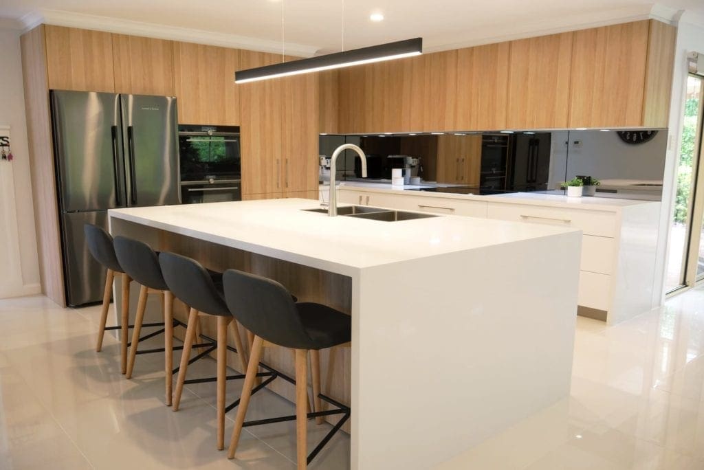 ultra modern two toned kitchen bargo waterfall edge kitchen island