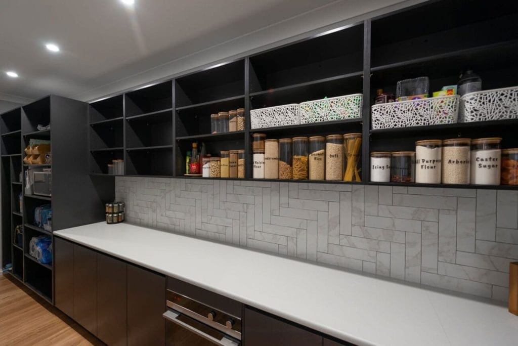 Striking two toned Hamptons kitchen Werombi butlers pantry shelving