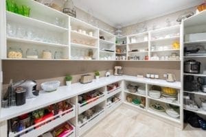 Butler's pantry with lots of open shelving and large open-face drawers