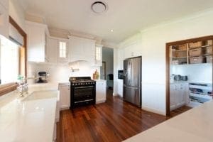 Open Butler's pantry with under bench cabinetry, large open-face drawers and overhead open shelving