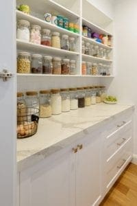 Butler's pantry with well-organised open shelving and under bench cabinetry