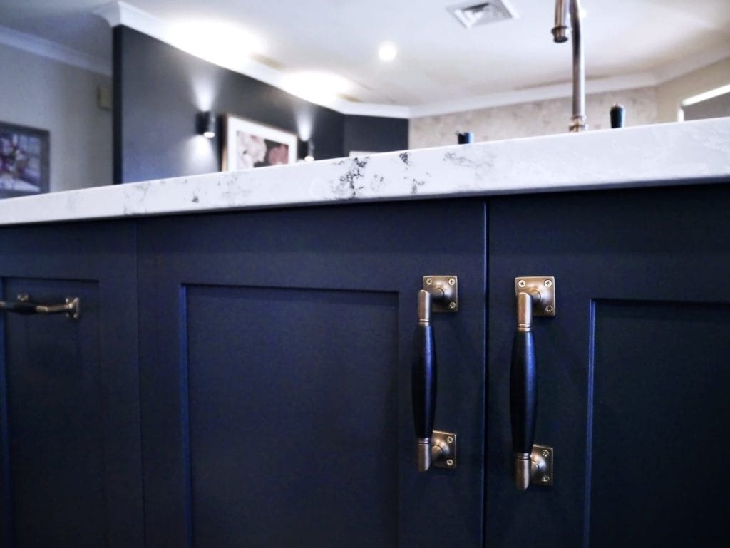 Dramatic two tones kitchen Bowral with brass handles and white marble stone