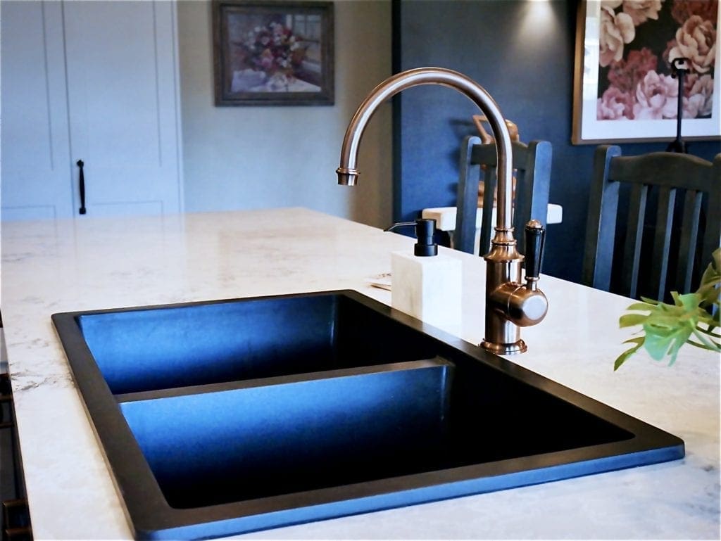 Dramatic two toned kitchen in Bowral black matte sink and brass tapwear