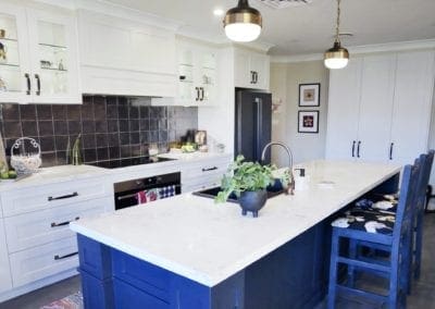 Dramatic two tones kitchen Bowral with metallic splashback