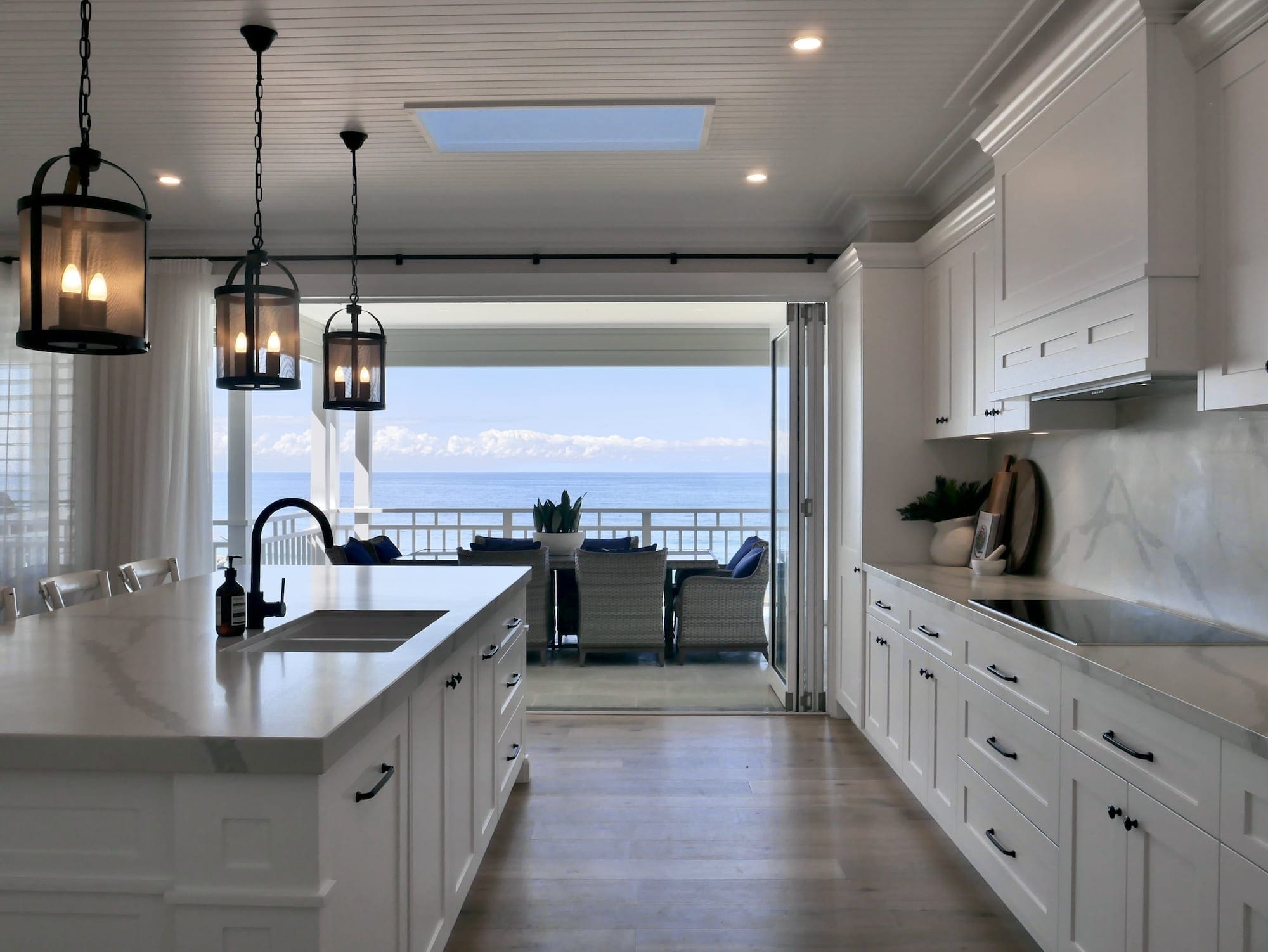 Character country filled kitchen in Mittagong white cabinetry with overhanging lights