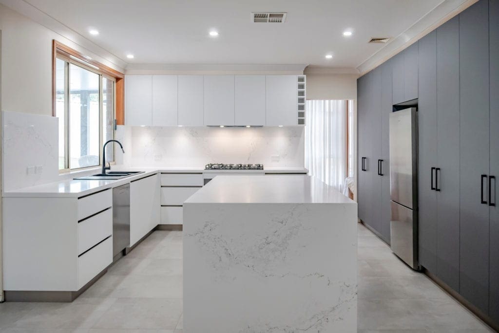 sleek black and white matte kitchen Harrington Park kitchen island wide shot