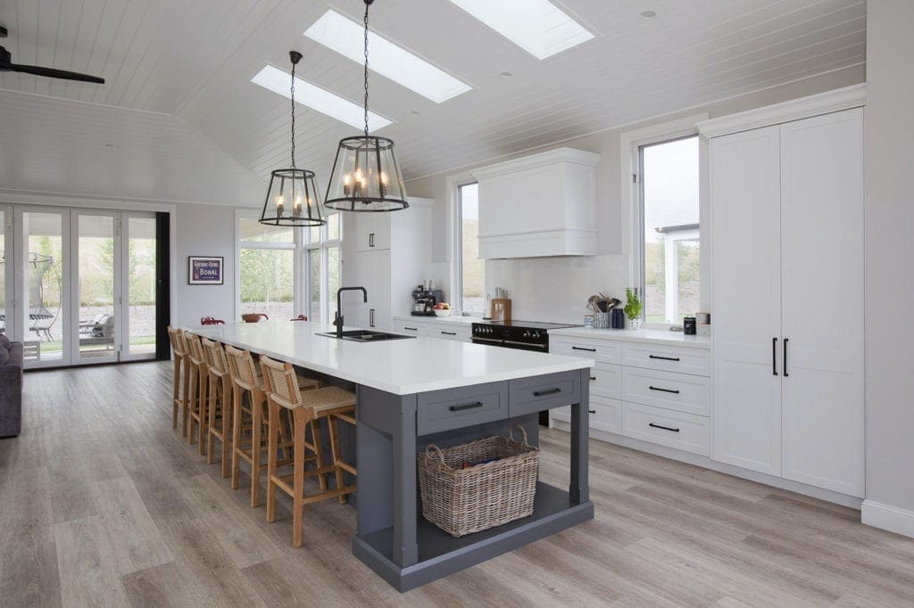 Stylish country hamptons style kitchen in moss vale white cabinetry and large kitchen island