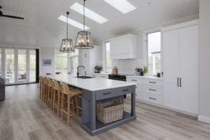 Stylish country hamptons style kitchen in moss vale white cabinetry and large kitchen island