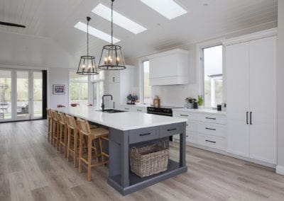 Stylish country hamptons style kitchen in moss vale white cabinetry and large kitchen island