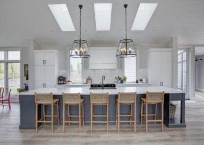 Stylish country hamptons style kitchen in moss vale large kitchen island handing pendant lights and wicken chairs