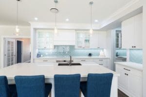 Modern contemporary kitchen with light blue hues kitchen island wide shot