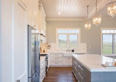 two toned kitchen Exeter with high ceilings and kitchen light pendants