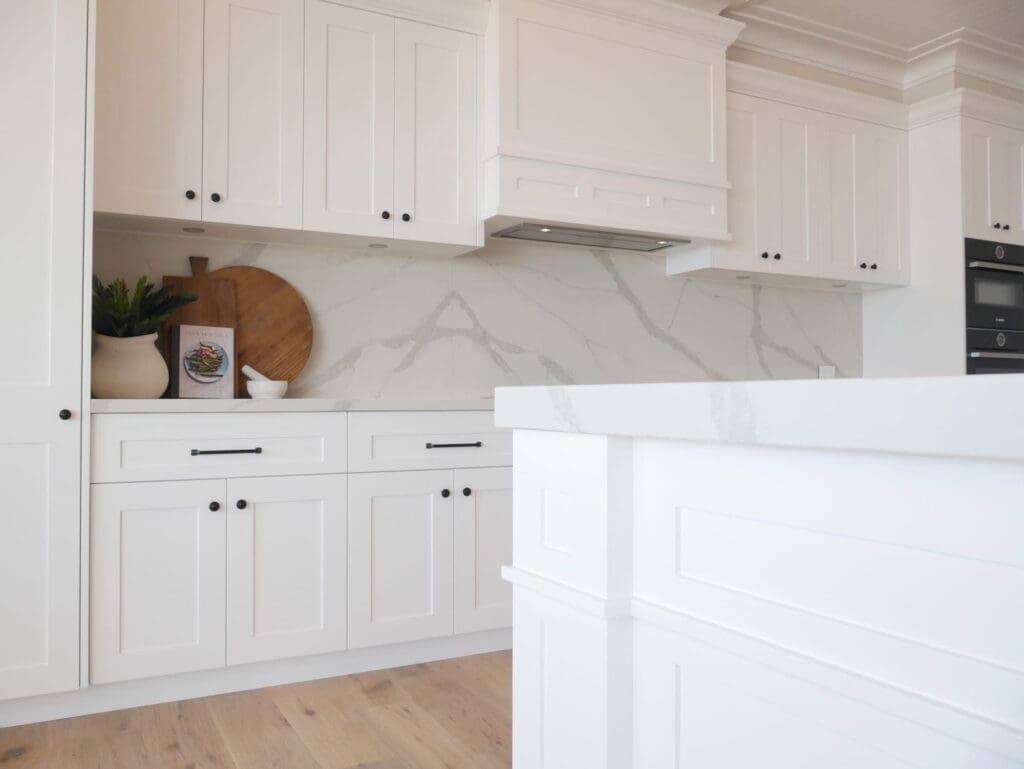 40mm mitred Smartstone Borghini Naturale benchtops and splashback maintaining an understated, elegant theme in the kitchen design.