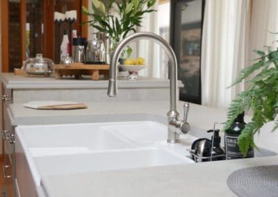 Stylish galley kitchen burradoo goosneck tap and white sink