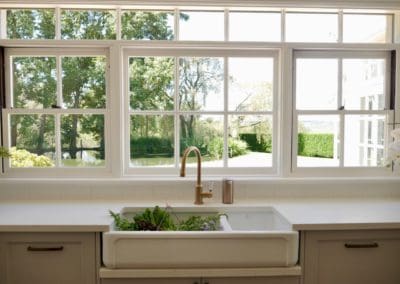 Travers stylish tranquil kitchen Manchester Square kitchen sink with brass tap and garden view window