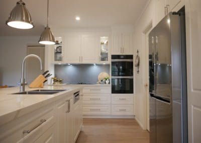 classic warm white kitchen Burradoo hamptons island benchtop and hanging light pendants