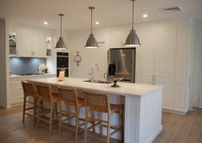 classic warm white kitchen Burradoo kitchen island and hanging pendants