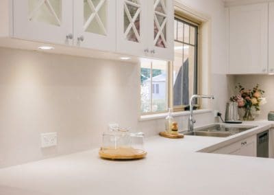 muted white and grey hamptons kitchen Caesarstone cloudburst concrete benchtop colo vale