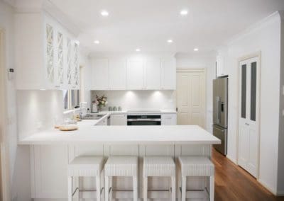 muted white and grey hamptons kitchen stone splash colo vale