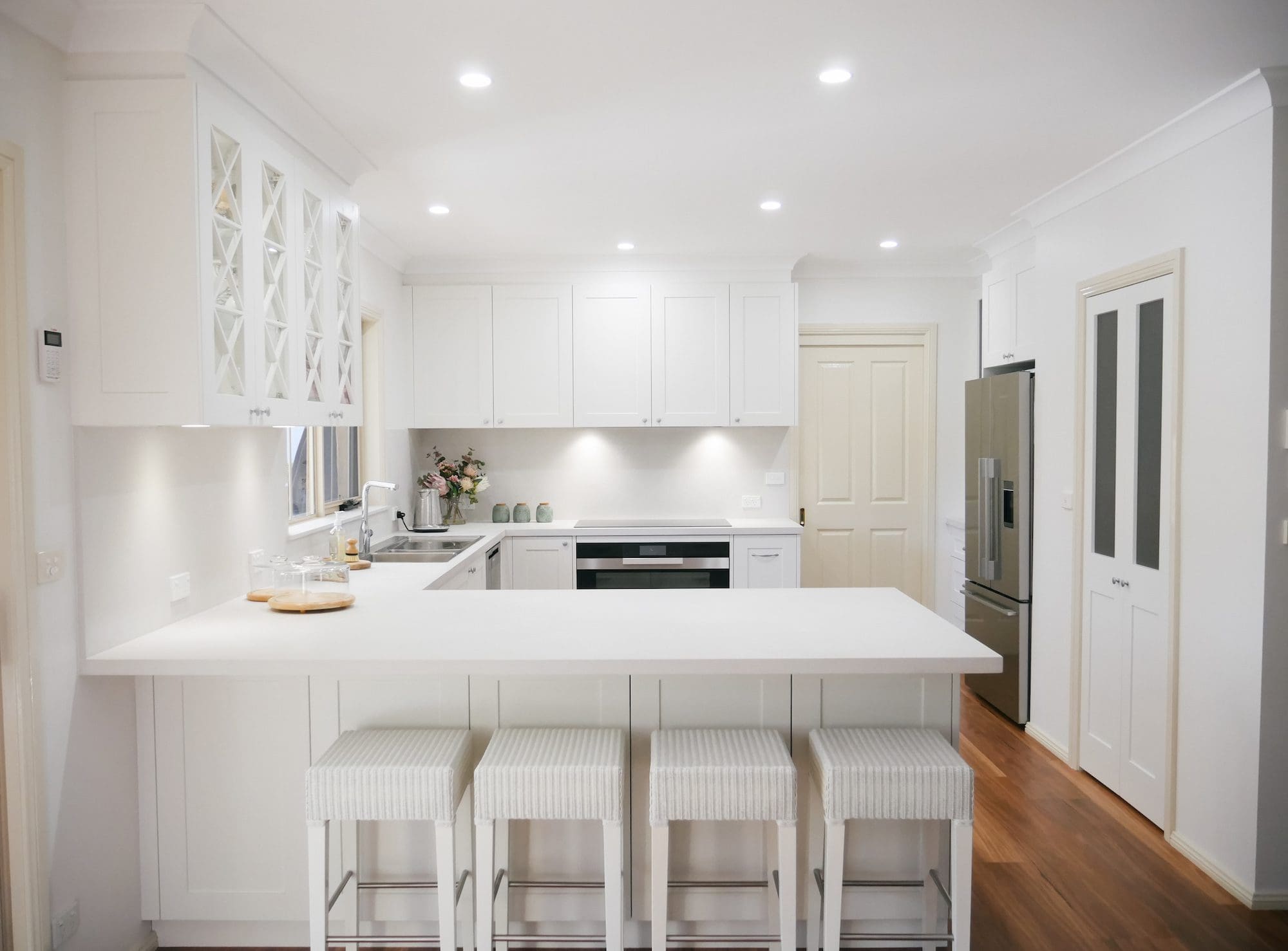 Muted-white-and-grey-Hamptons-kitchen-banner-colo-vale classic warm white kitchen Burradoo wide angle kitchen