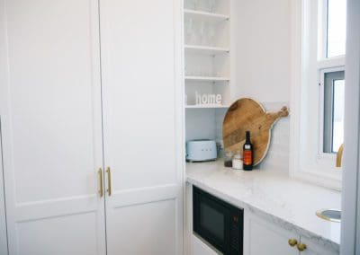 glamorous and bold two toned hamptons kitchen shell cove butlers pantry