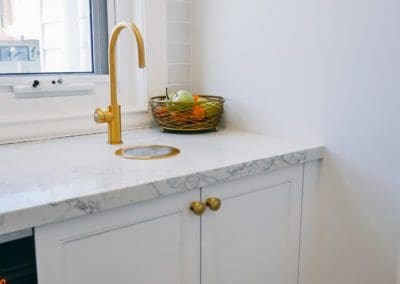 glamorous and bold two toned hamptons kitchen shell cove gold zip tap in butlers pantry