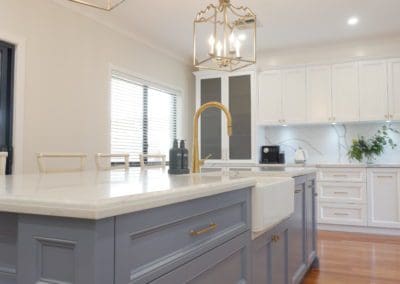 Elegant refined two toned kitchen Harrington Park kitchen island carriage lights