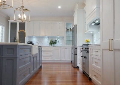 Elegant refined two toned kitchen Harrington Park kitchen island proud kicks