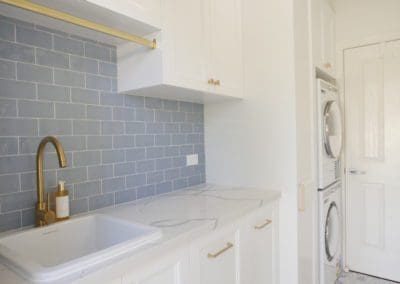 Elegant refined two toned kitchen Harrington Park laundry cabinet